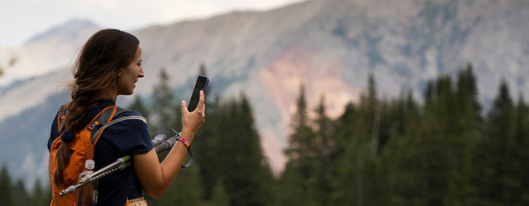 a person with a camera on a mountain